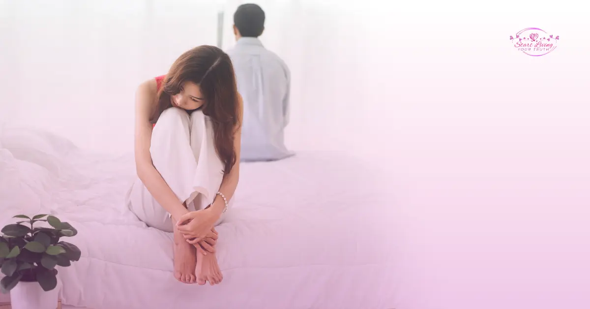 Couple emotionally distant on bed, relationship issues.