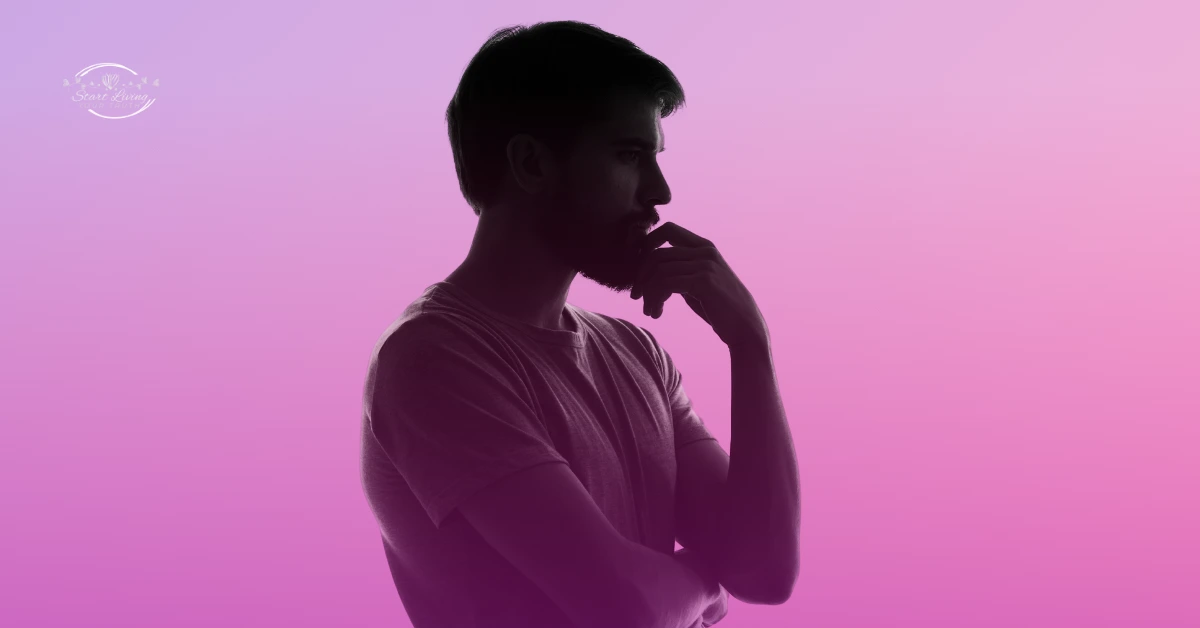 Silhouette of man thinking against pink-purple background
