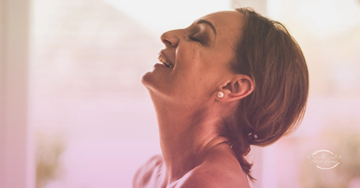 Woman smiling and relaxed indoors