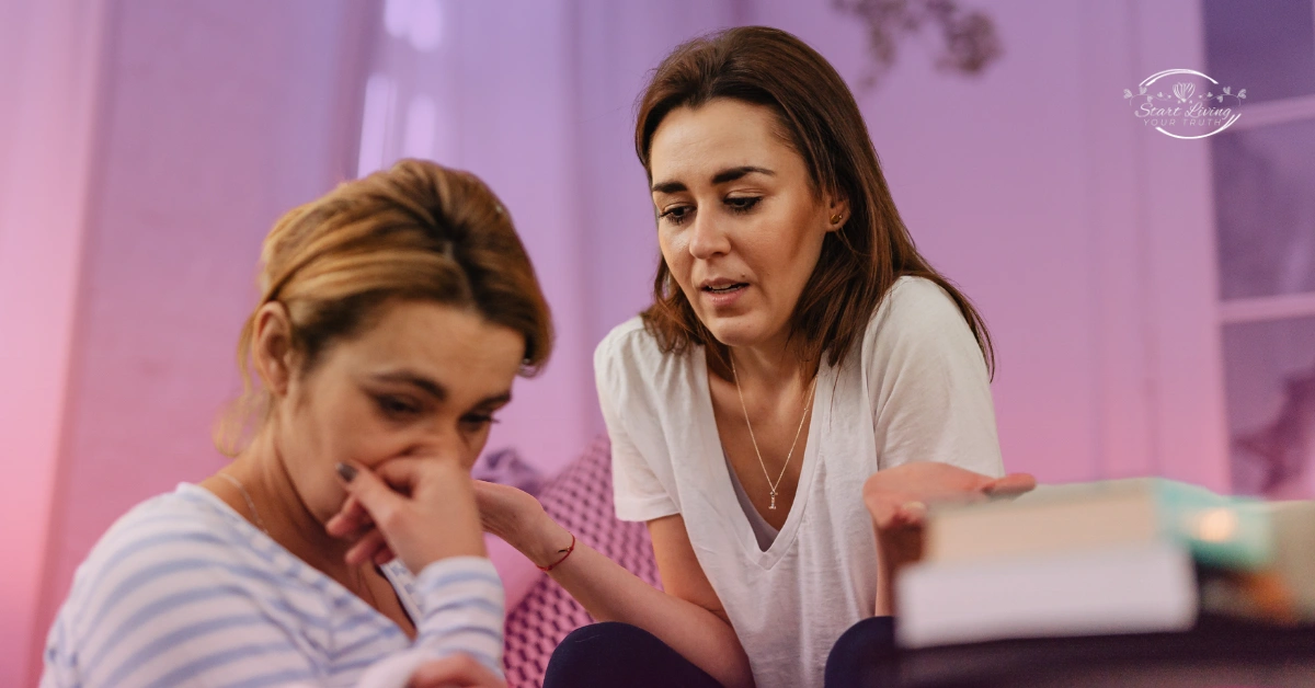 Two women talking, one looks concerned and supportive.
