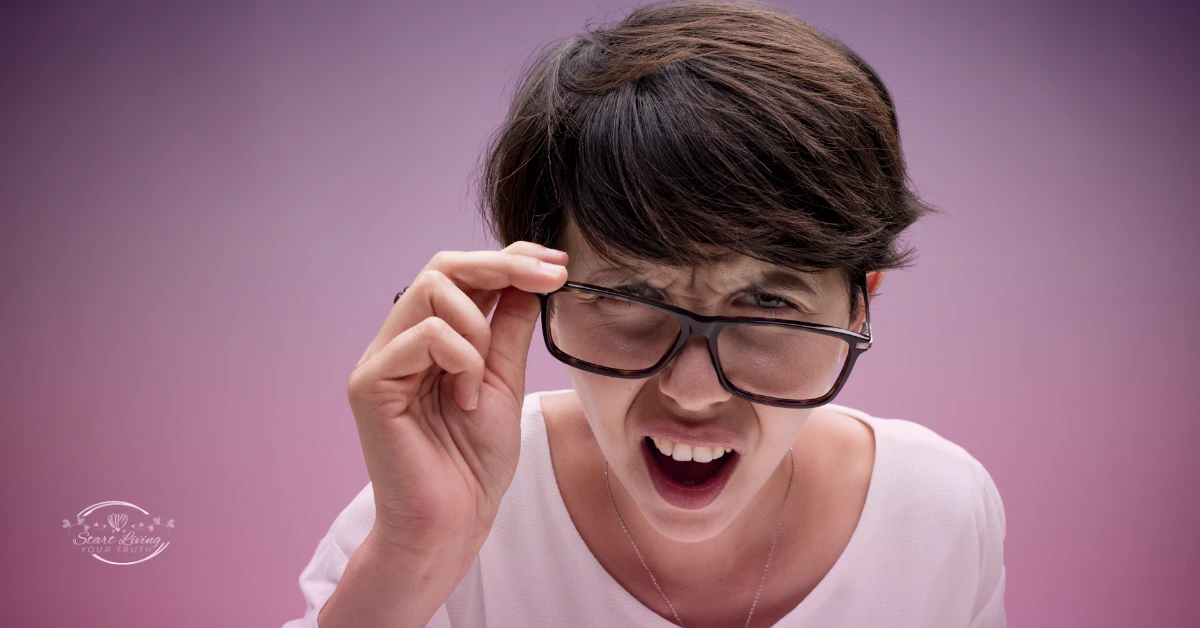 Woman adjusting glasses, surprised expression.