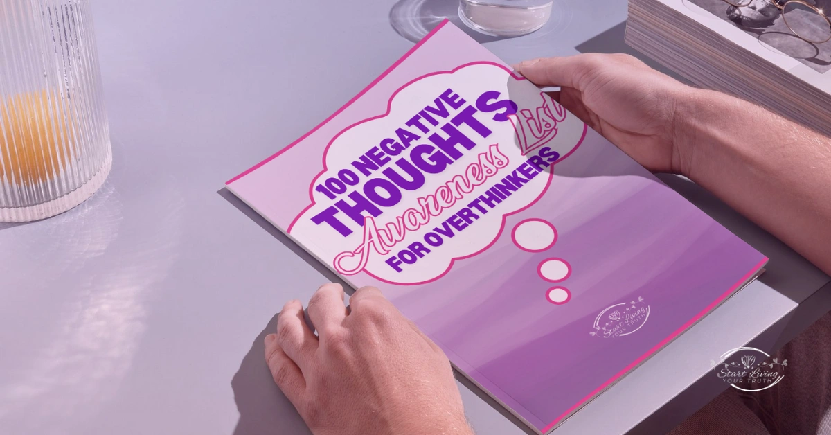 Holding a booklet on negative thoughts awareness.