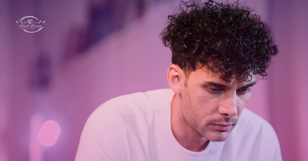 Person deep in thought with curly hair.